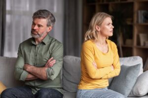 Adults sitting across each other